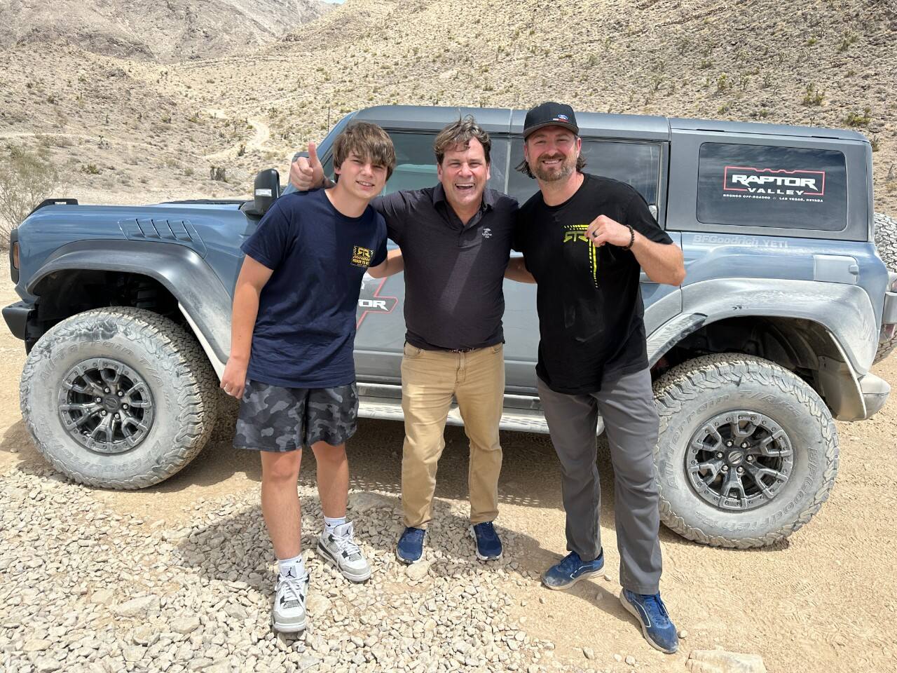 Jim and Jameson Farley pose with Vaughn Gittin Jr. at the Raptor Valley experience at Bronco Off-Roadeo Nevada.